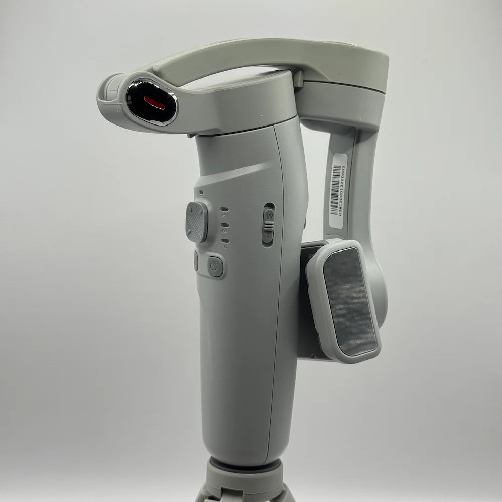 Close up side view of folded grey 3-AXIS Merak One smartphone stabilizer arm and phone holder