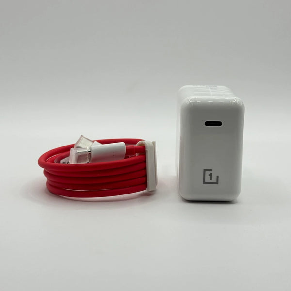 OnePlus 1+ 65W Warp Charger adapter next to coiled red Type-C to Type-C cable