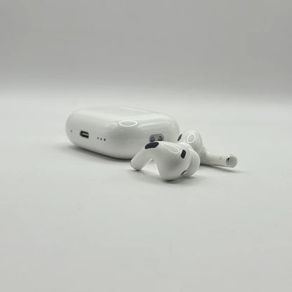Close up view of AirPods Pro 2 ear-tips and charging case on plain background