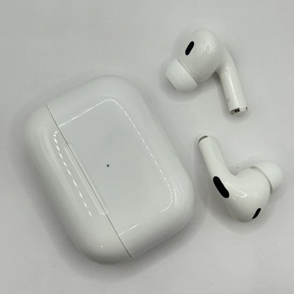 Top down view of AirPods Pro 2 earbuds resting alongside glossy white charging case