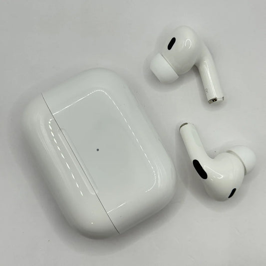 Top down view of AirPods Pro 2 earbuds resting alongside glossy white charging case