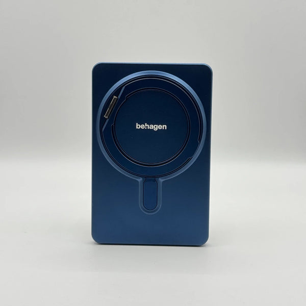 Back view of metallic navy blue behagen magnetic power bank with integrated flush ring holder