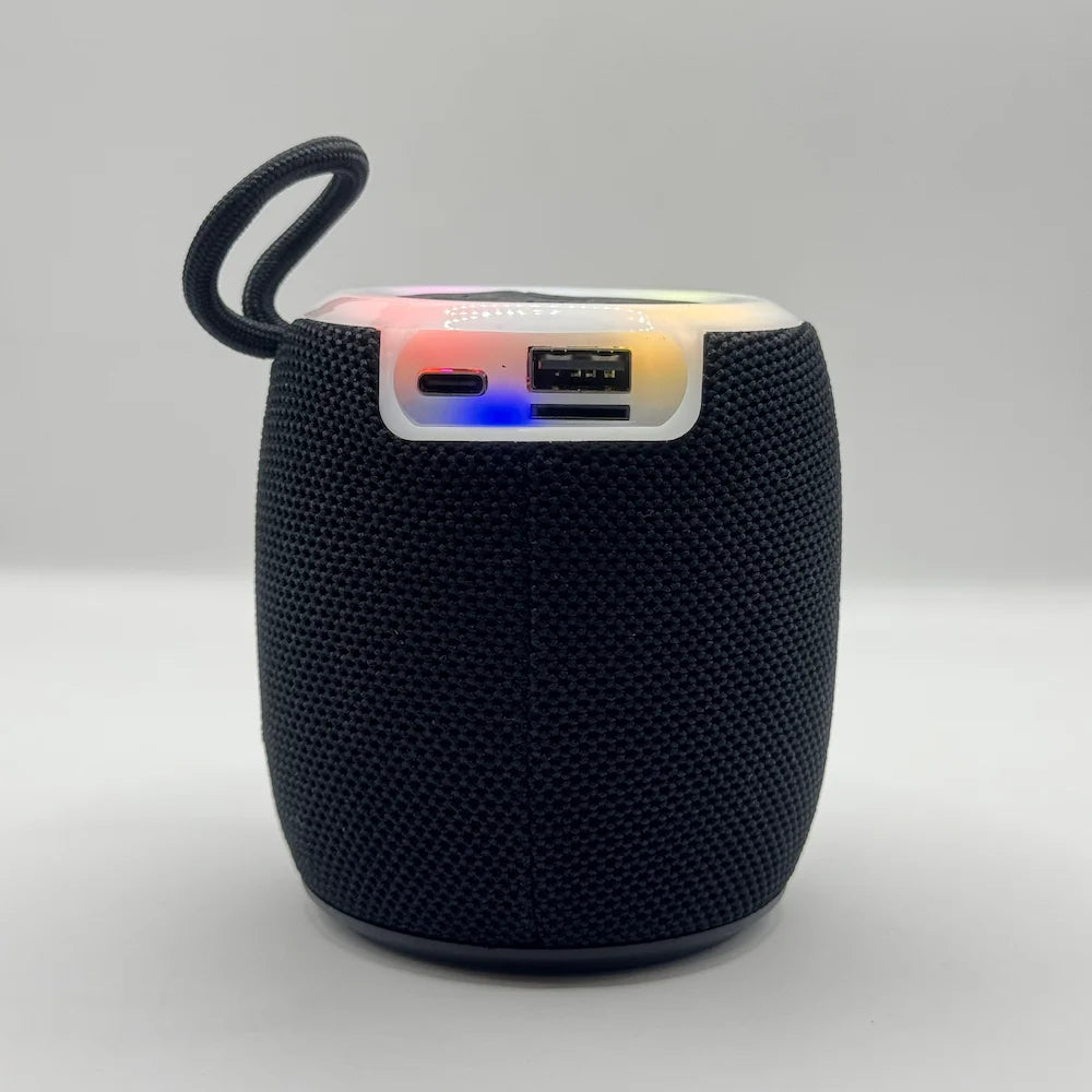 Back angle of BLUK'S BX-176 portable speaker highlighting port section with glowing RGB LED status light