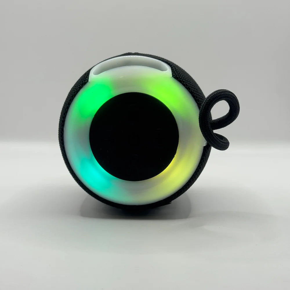 Top-down view of BLUK'S BX-176 wireless speaker showing vibrant illuminated multi-color RGB light ring