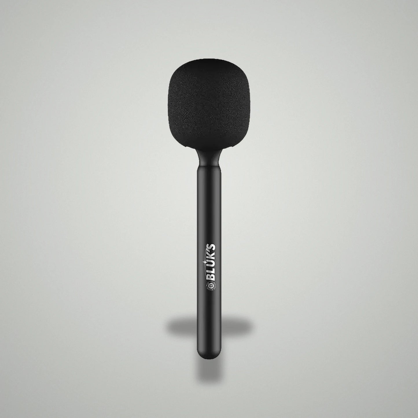 Assembled BLUK'S BX-111 handheld wireless interview microphone with black foam windscreen