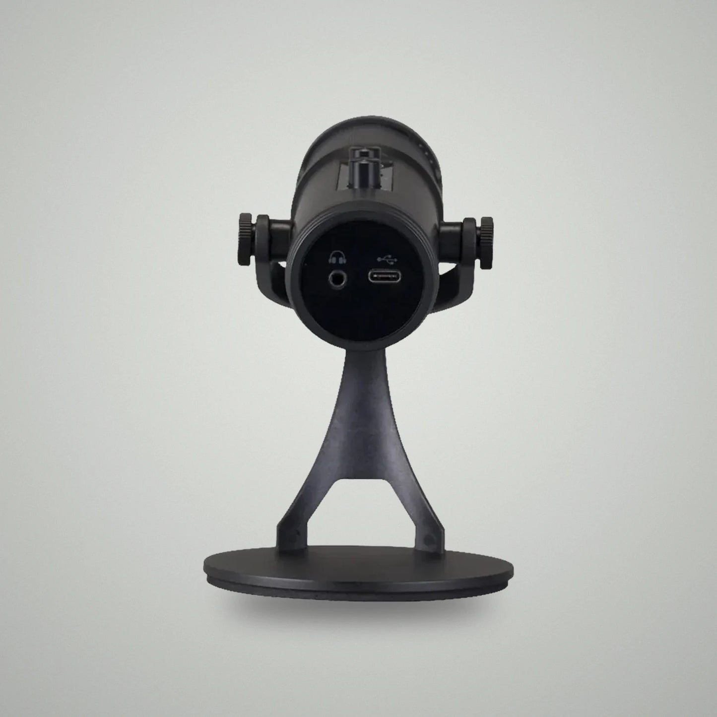 Bottom base view of BLUK'S BX-120 microphone showing 3.5mm headphone monitoring jack and USB Type-C power port