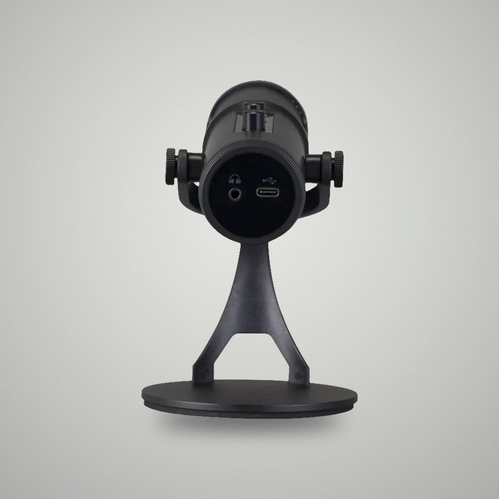 Bottom base view of BLUK'S BX-120 microphone showing 3.5mm headphone monitoring jack and USB Type-C power port