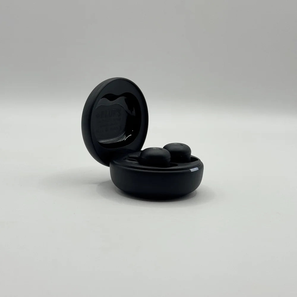 Open charging case revealing compact black BLUK'S BX-606 nano wireless earbuds seated inside