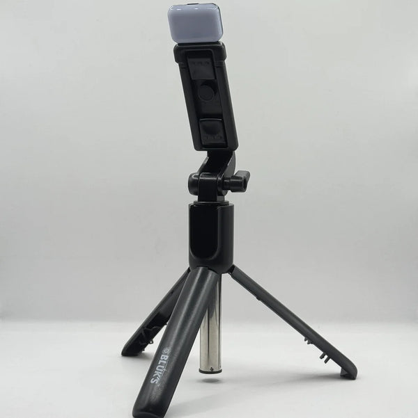 Bluk's BX310 black selfie stick tripod set up in standing position with top LED fill light attachment