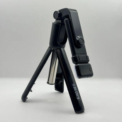 Close up view of Bluk's BX310 folded lightweight selfie stick tripod showing brand logo and compact design