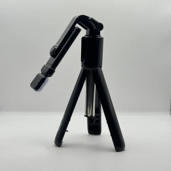 Side perspective of Bluk's BX310 black mini tripod stand with adjustable phone holder mount