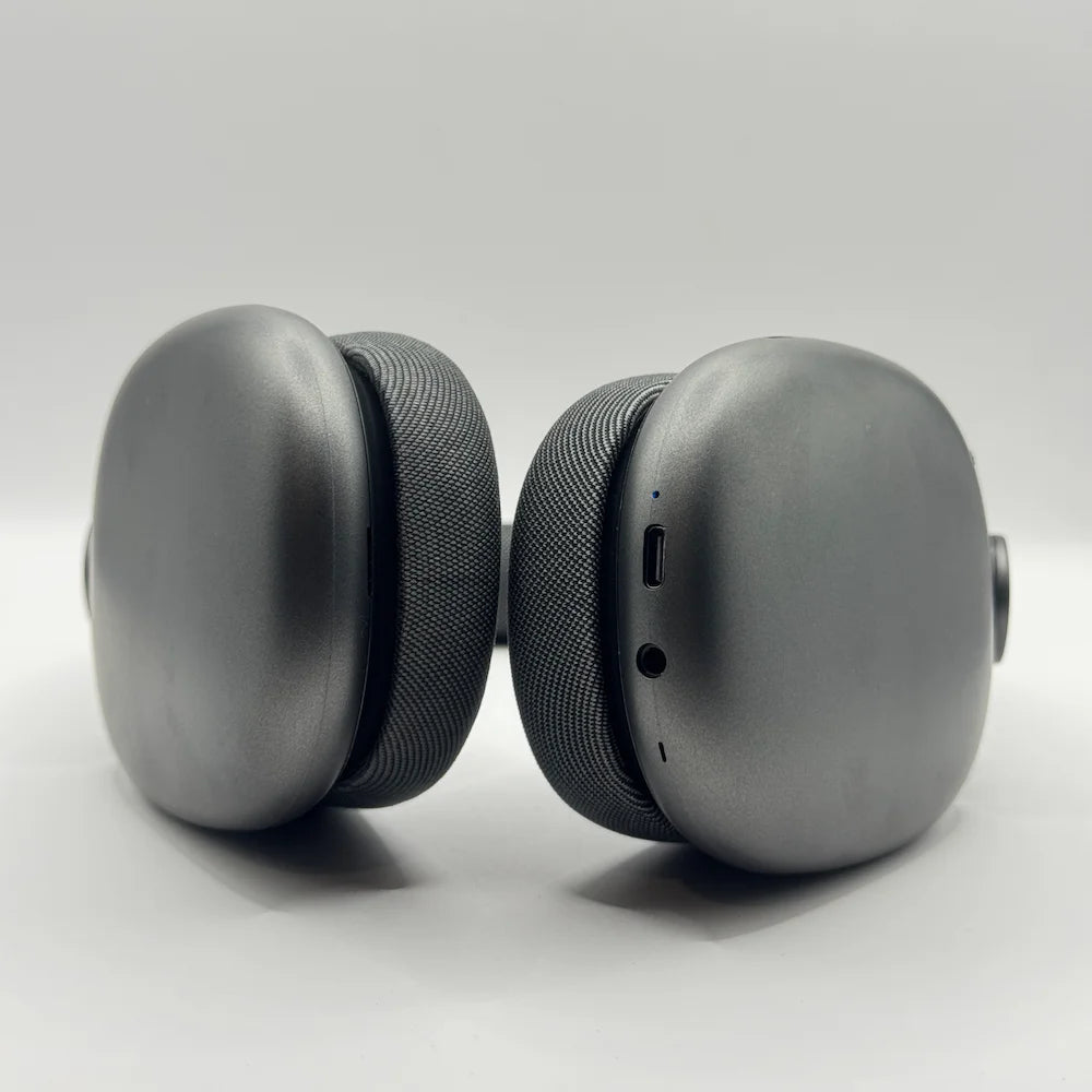 Bottom shot of BLUK'S WAVEONIC BX-84 earcups highlighting Type-C charging port, 3.5mm AUX jack, and LED indicator