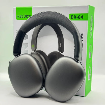 BLUK'S WAVEONIC BX-84 dark grey over-ear wireless headphones displayed in front of green and white retail packaging