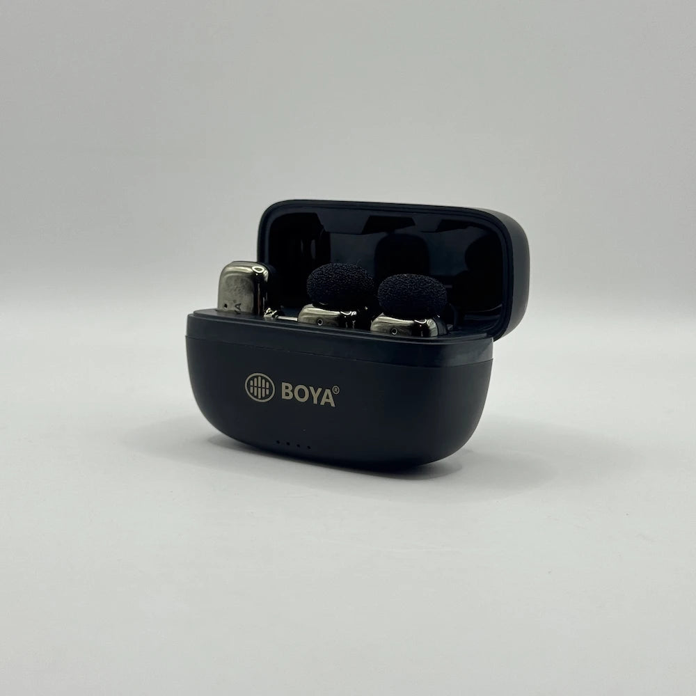 Front perspective view of opened BOYA BY-MW10 charging case with dual clip-on microphones docked inside