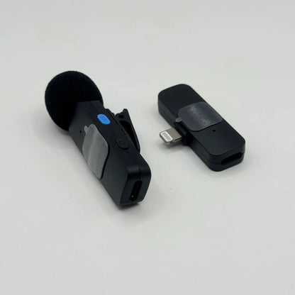 Close-up perspective of BOYA BY-V1 wireless transmitter with blue NR noise reduction button and Lightning connector receiver