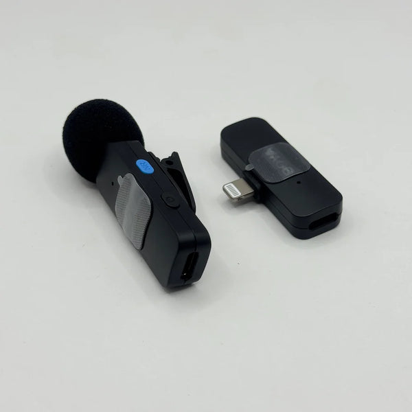 Close-up perspective of BOYA BY-V1 wireless transmitter with blue NR noise reduction button and Lightning connector receiver