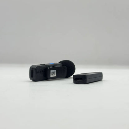 Side angle of BOYA BY-V1 transmitter clip and pass-through Type-C charging port on the Lightning receiver