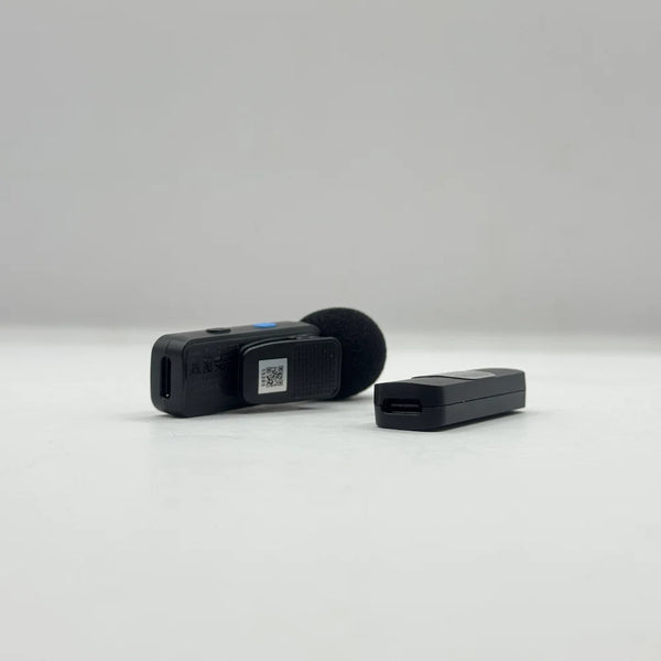Side angle of BOYA BY-V1 transmitter clip and pass-through Type-C charging port on the Lightning receiver