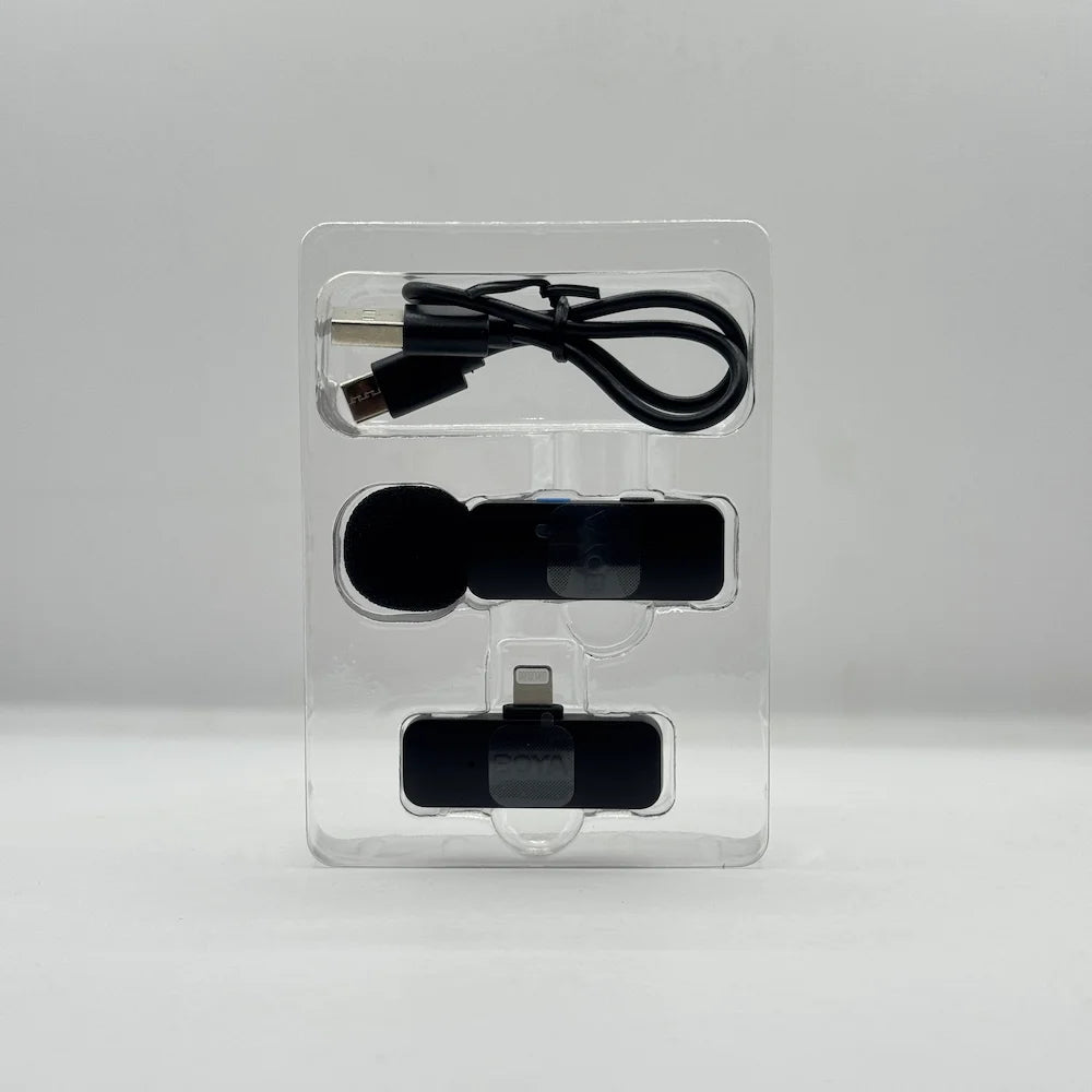 BOYA BY-V1 wireless mic transmitter, Lightning receiver, and USB charging cable organized inside clear plastic inner tray