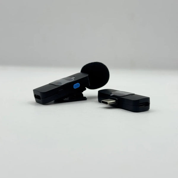Close-up view of BOYA BY-V10 mic transmitter showing blue NR noise reduction button alongside the USB-C receiver plug