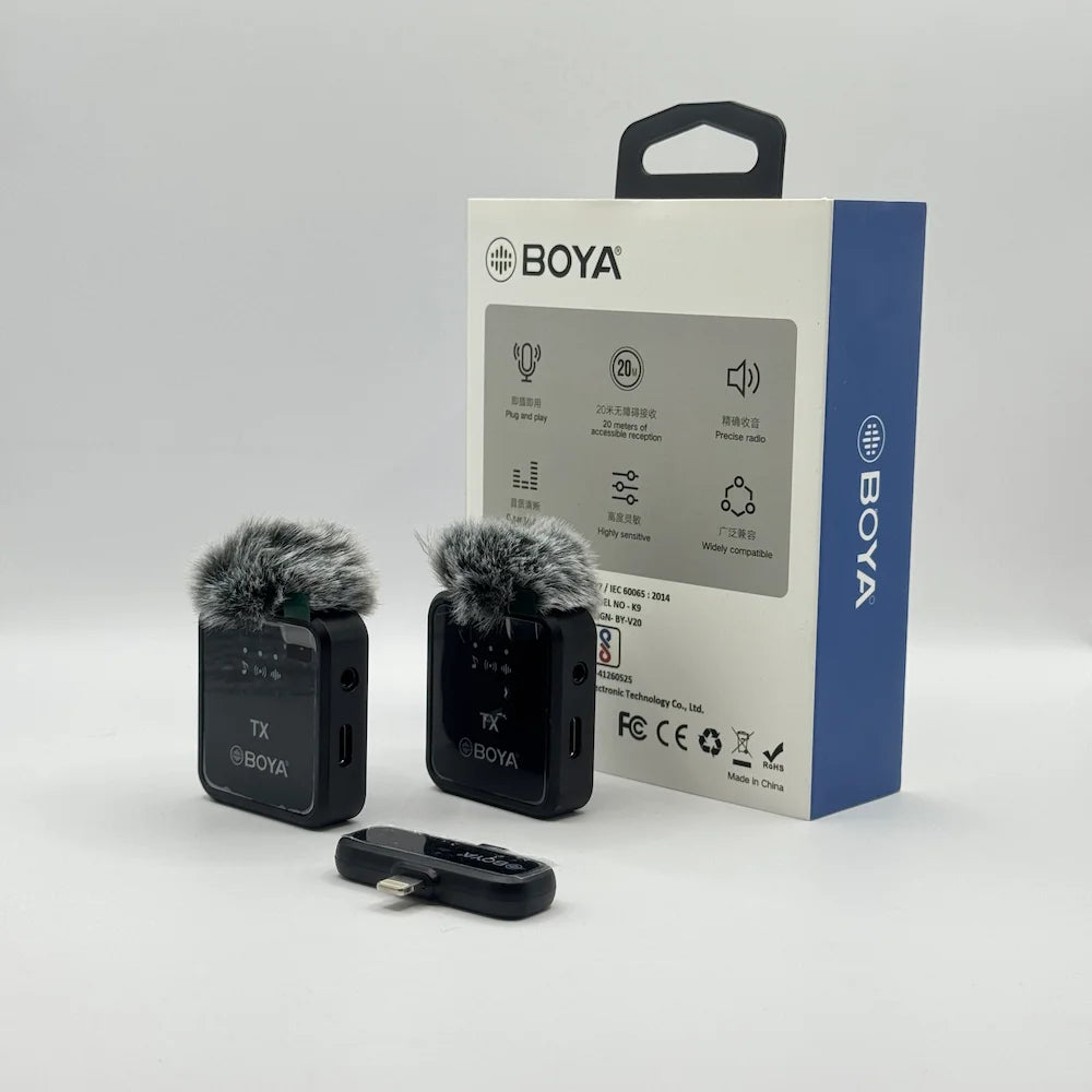 Back view of BY-V20 microphone box highlighting 20 meter range and plug and play features alongside wireless transmitters
