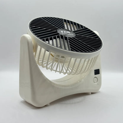 Cream portable desk fan tilted upward demonstrating 360 degree vertical angle adjustment