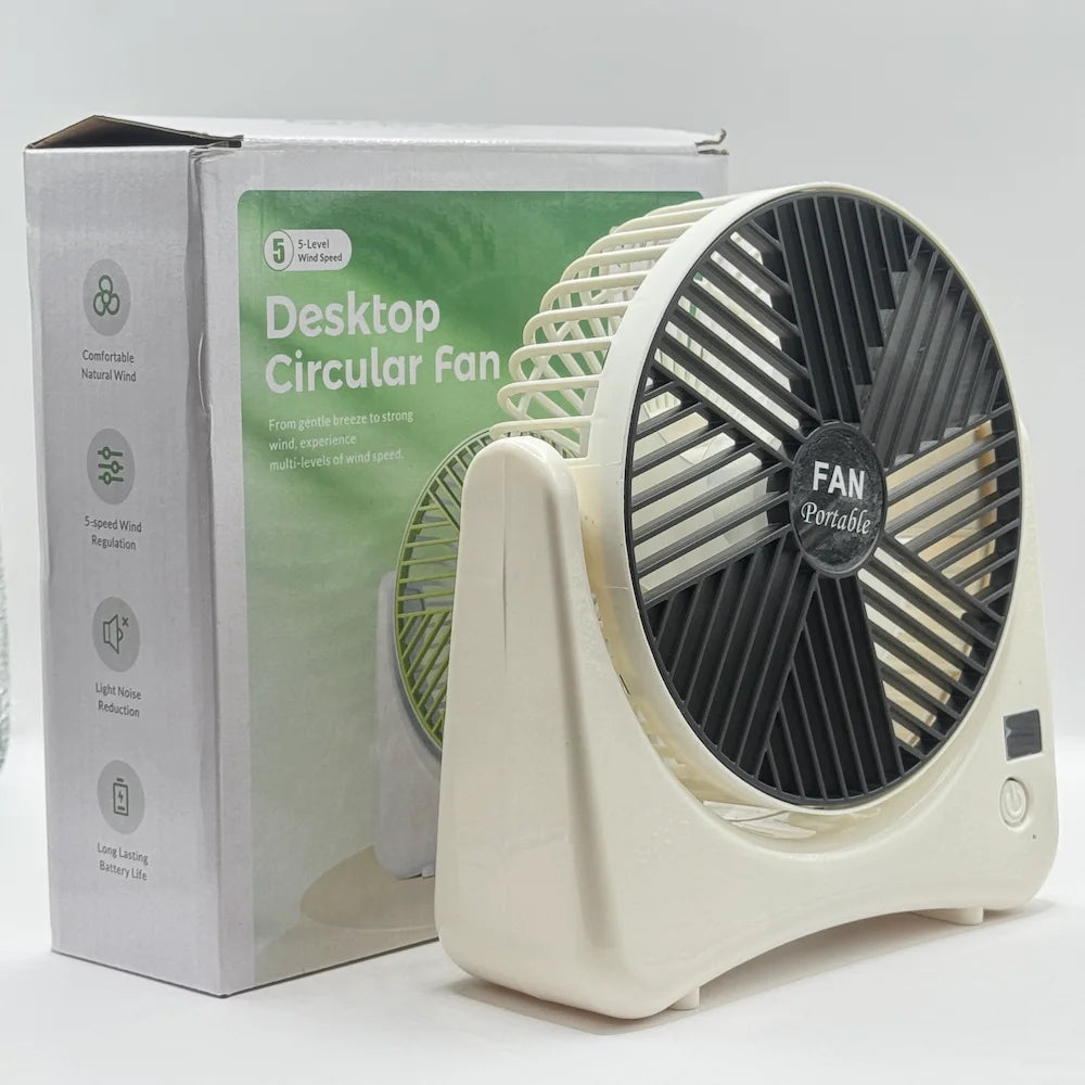 Desktop circular fan standing next to white and green box showing quiet noise reduction and battery life icons