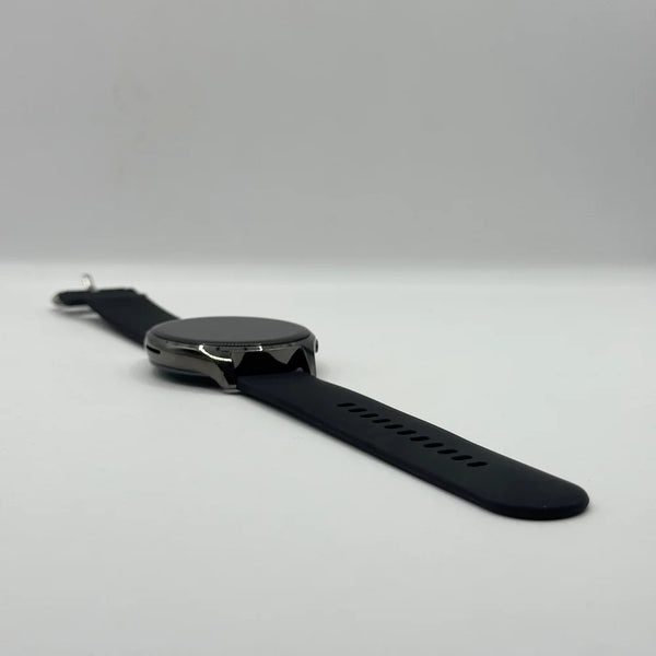 Flat perspective view of Haino Teko RW-10 round smartwatch laid out with black silicone strap