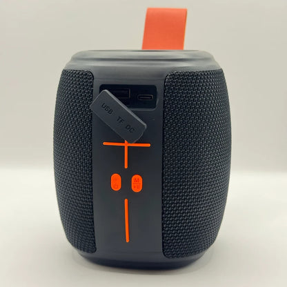 HM-805 speaker with open rubber flap revealing USB TF card and DC charging ports