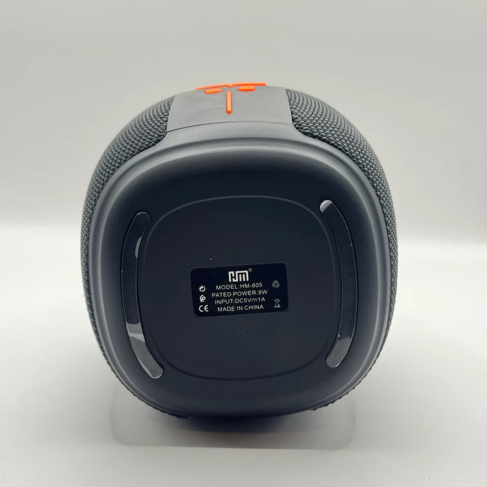 Bottom view of HM-805 speaker showing model details and 8W rated power label