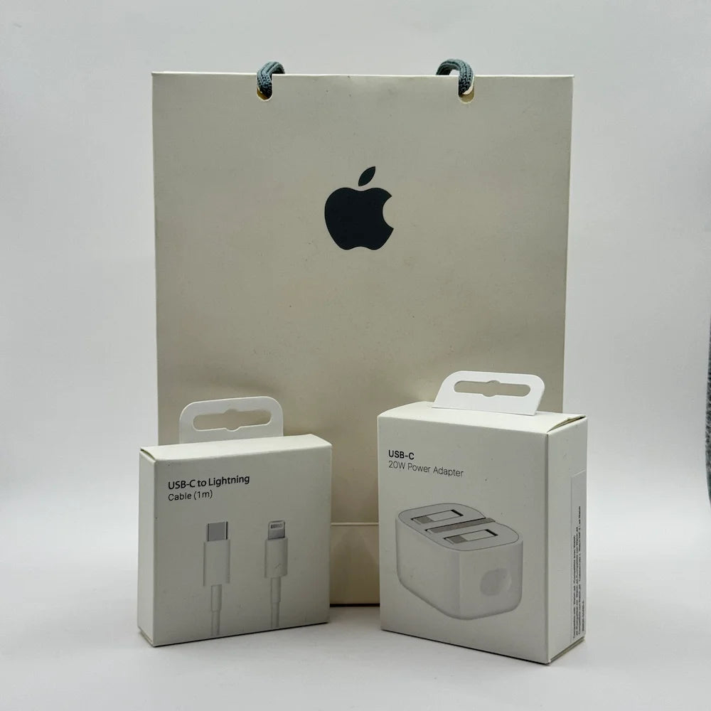 iPhone 20W USB-C Power Adapter and Lightning Cable boxes in front of paper bag