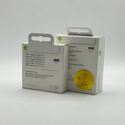 Side view showing Apple 20W charger box with warranty seal and cable box