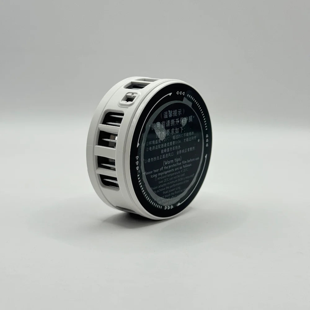 Rear view of K51 mobile phone cooler showing the circular magnetic semiconductor cooling plate with protective film text