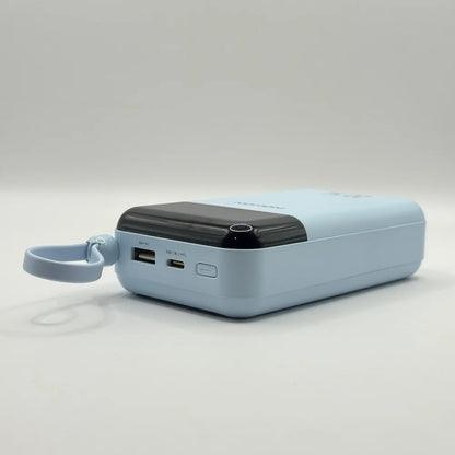 Side layout view of light blue NOHON LS-DY259 power bank showing USB-A port, Type-C port, and power button