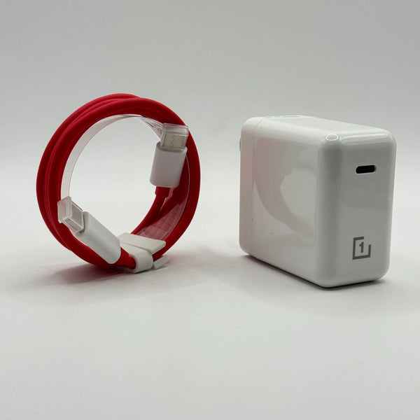 OnePlus 1+ 65W fast charger adapter next to looped red Type-C charging cable