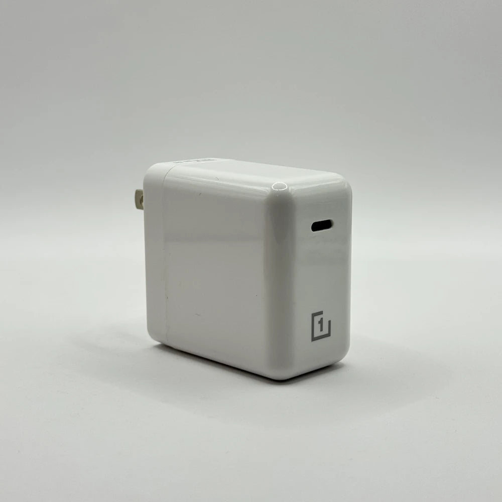 OnePlus 1+ 65W Warp Charge adapter showing single USB-C output port side view