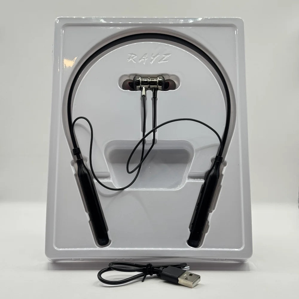 RAYZ RNB-02 black wireless neckband earphones lying in inner white packaging tray alongside USB charging cable