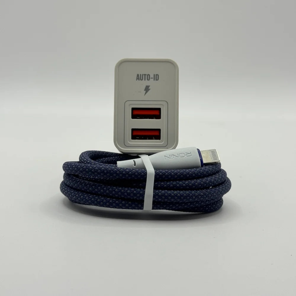 Front view of Ronin R-615 Encore dual USB charging ports resting behind coiled blue iOS Lightning cable