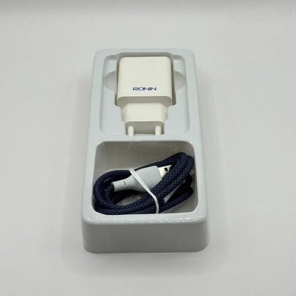 Ronin R-615 Encore white adapter and blue braided charging cable resting inside inner plastic packaging tray