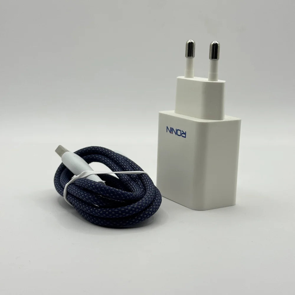 Standalone Ronin R-615 Encore white wall plug charger positioned beside durable coiled braided cable