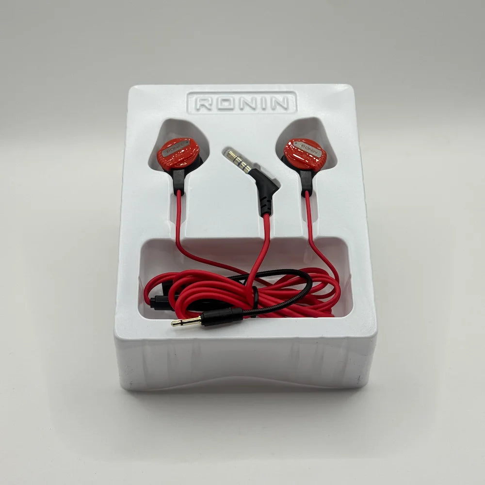 Ronin R-860 Chaos red wired gaming earphones resting inside plastic packaging tray