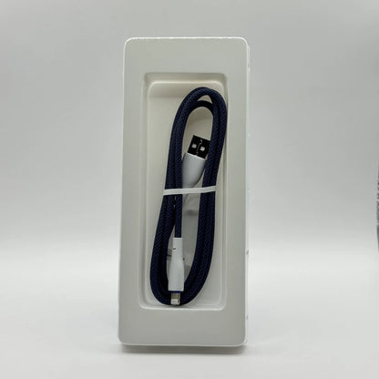 Dark blue braided Ronin R-2025 Lightning cable in inner packaging tray