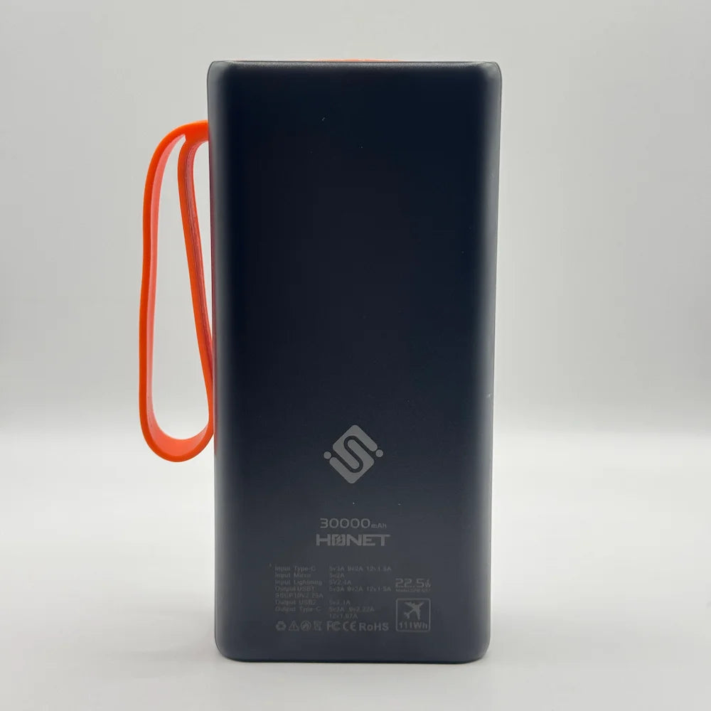 Back view of black SOVO SPB-677 30000mAh power bank showing technical input output specs and airline approved rating