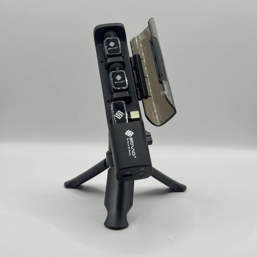 Open view of SOVO SPEAK PRO dock displaying two clip-on mics and Type-C receiver