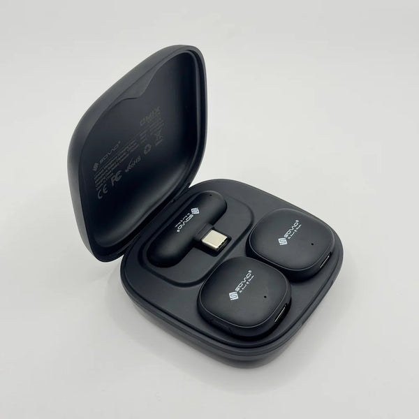 Top-down view of SOVO SWM-578 AI wireless mic setup resting inside open charging case